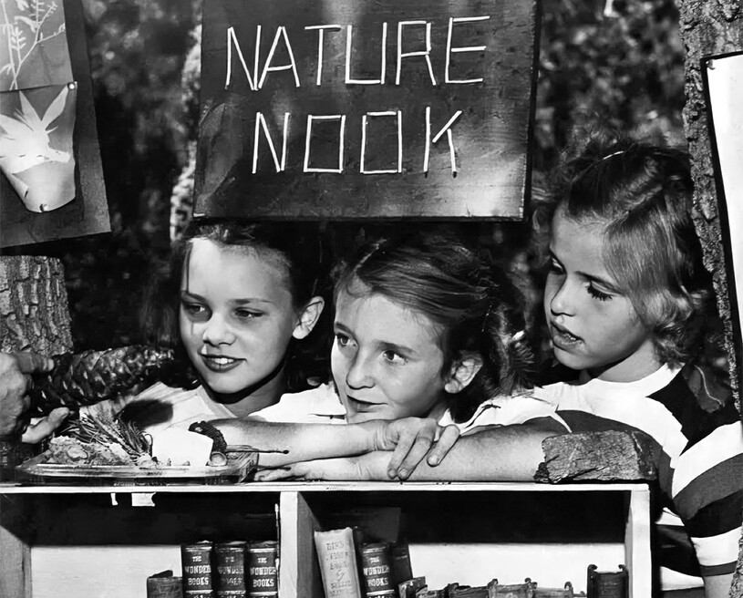 Children sitting at Book Nook display